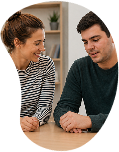 Caregiver and autistic person working together at a table